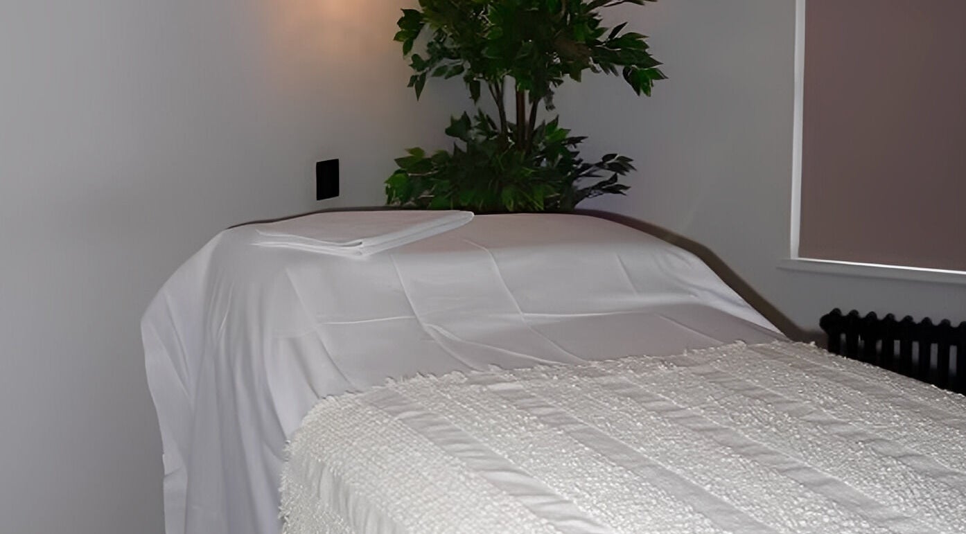 Tranquil spa room at Figured It in Hessle, England, GB with a massage table and calming decor.