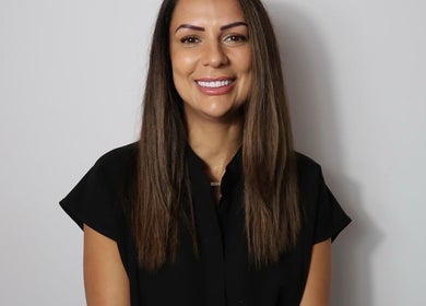Smiling professional at Figured It in Hessle, England, GB, exuding warmth and approachability.