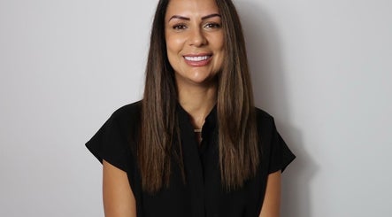 Smiling professional at Figured It in Hessle, England, GB, exuding warmth and approachability.
