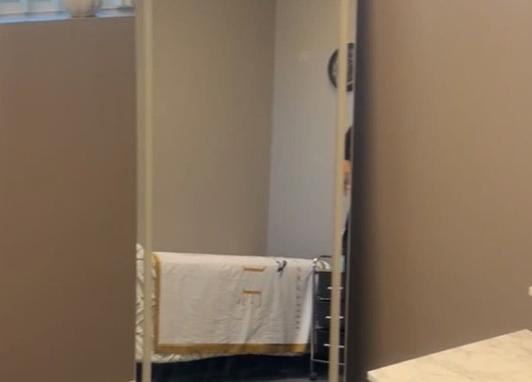 Elegant therapy room at Nduljé By Ebony in Crestview, Florida, US with a large mirror and soft lighting.