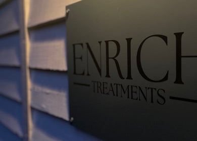 Enrich Treatments sign at Saffron Walden, England, GB, showcasing elegant venue entrance.