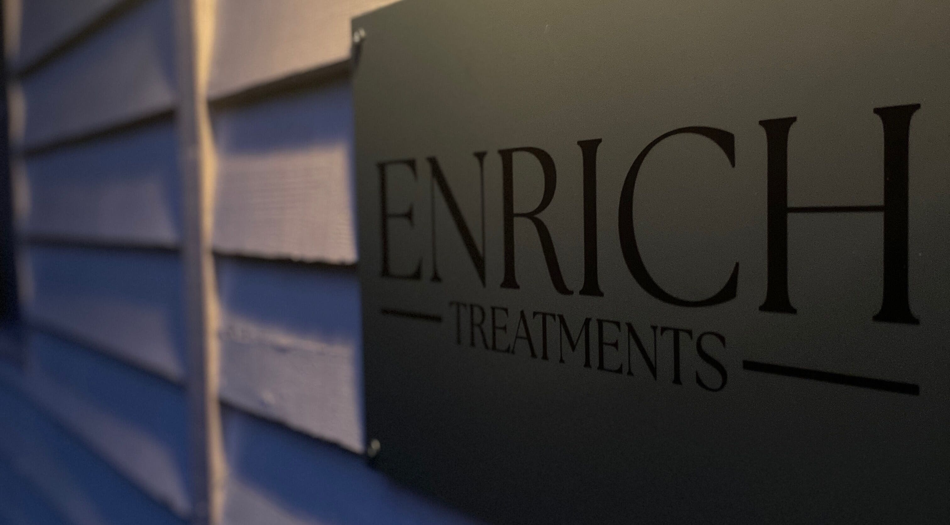 Enrich Treatments sign at Saffron Walden, England, GB, showcasing elegance and modern design.