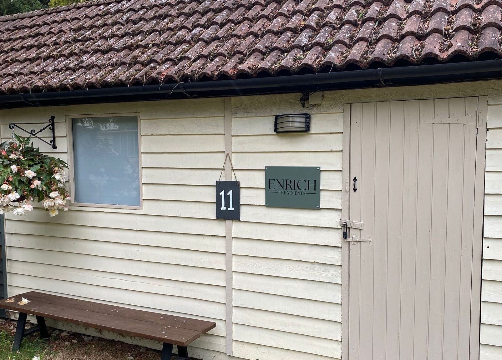 Entrance of Enrich Treatments in Saffron Walden, England, GB with a welcoming rustic decor.