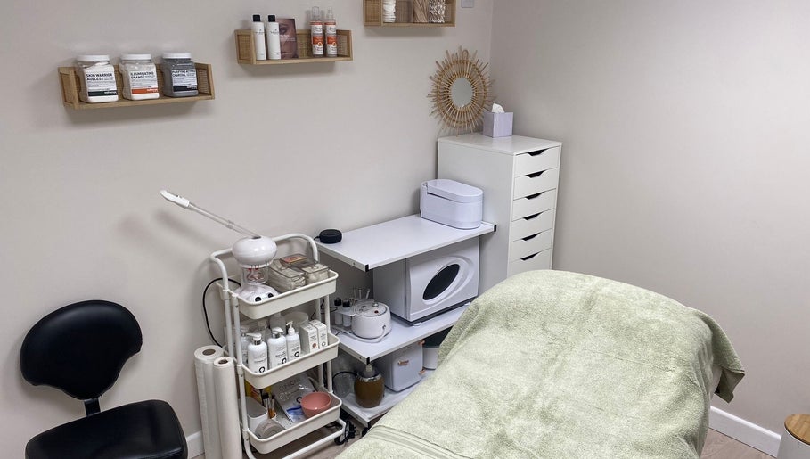 Calm treatment room at Beauty By Tash, Andover, England, GB, showcasing spa essentials and a cozy bed.