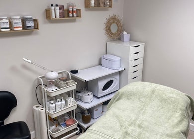 Calm treatment room at Beauty By Tash, Andover, England, GB, showcasing spa essentials and a cozy bed.