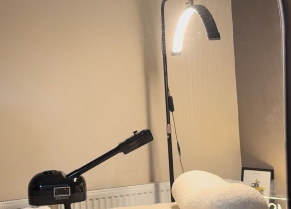 Modern wellness space at MSKN, Manchester, England, GB with soothing lighting and beauty equipment.