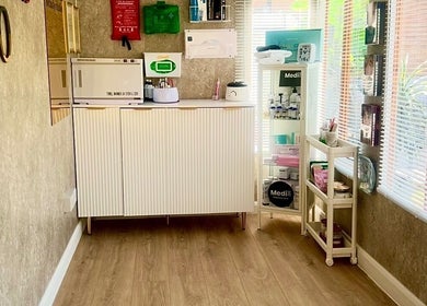 Skinthetics Studio's well-lit treatment area with skincare products in Droitwich Spa, England, GB.