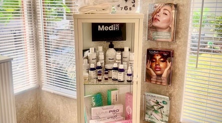 Elegant skincare products on a shelf at Skinthetics Studio in Droitwich Spa, England, GB, enhancing wellness.