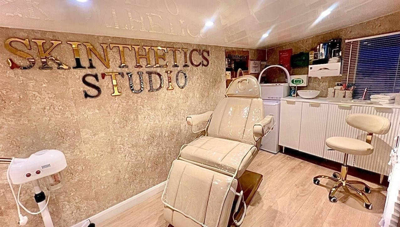 Luxurious treatment room at Skinthetics Studio, Droitwich Spa, England, GB, showcasing a comfortable chair.