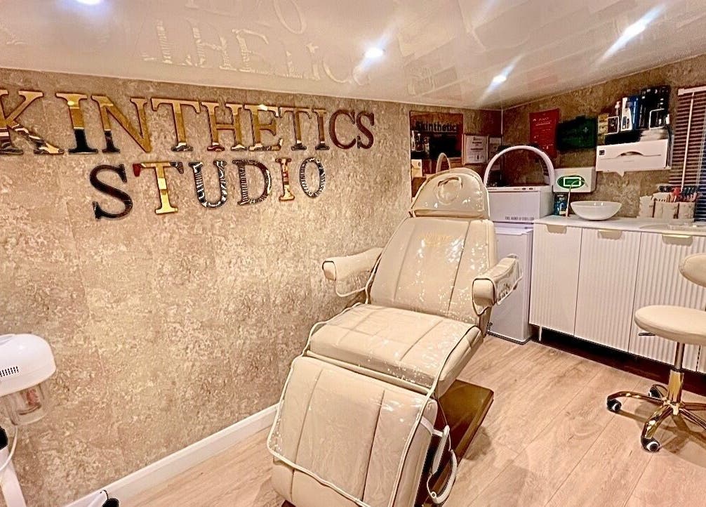 Luxurious treatment room at Skinthetics Studio, Droitwich Spa, England, GB, showcasing a comfortable chair.