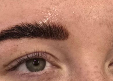 Close-up of perfectly shaped eyebrows at RAE - Shade Salon, Worsley, England, GB offering professional beauty services.