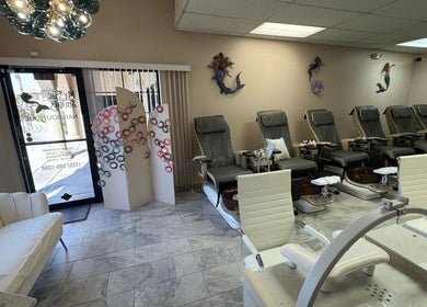 Chic interior of Mystic Sirens Nail Boutique in Las Vegas, Nevada with plush seating and decor.
