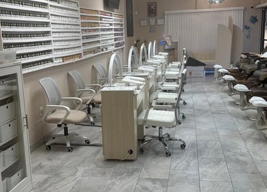 Modern nail salon interior at Mystic Sirens Nail Boutique, Las Vegas, Nevada, US, featuring professional workstations.