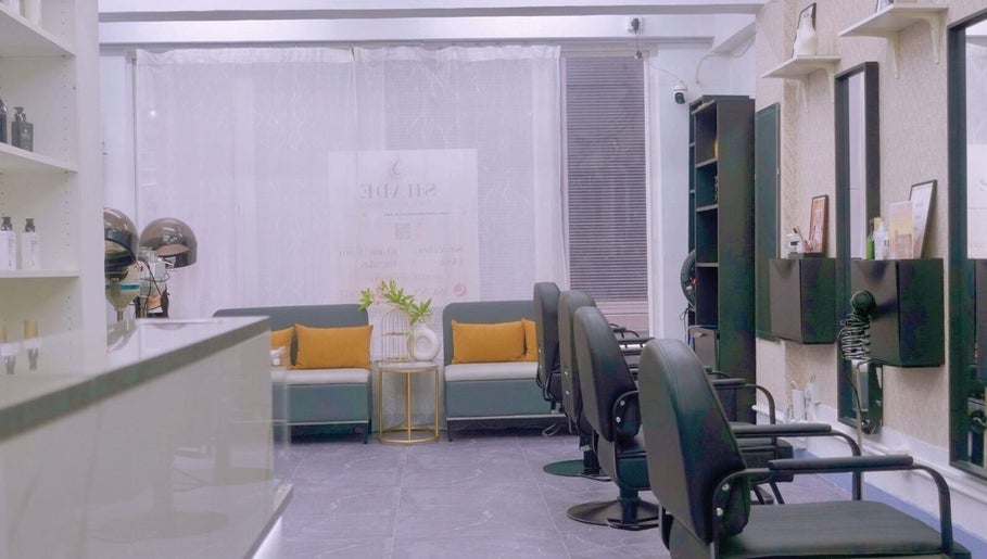 Modern interior of SHADE HAIR AND BEAUTY SALON on Hong Kong Island, featuring stylish chairs and decor.
