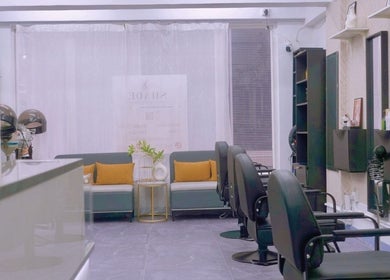 Modern interior of SHADE HAIR AND BEAUTY SALON on Hong Kong Island, featuring stylish chairs and decor.