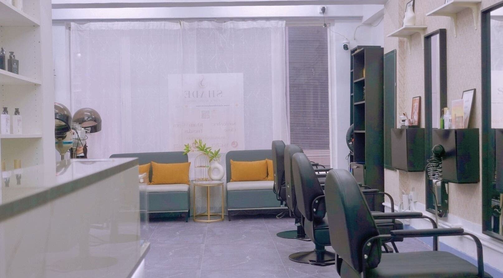 Modern interior of SHADE HAIR AND BEAUTY SALON on Hong Kong Island, featuring stylish chairs and decor.