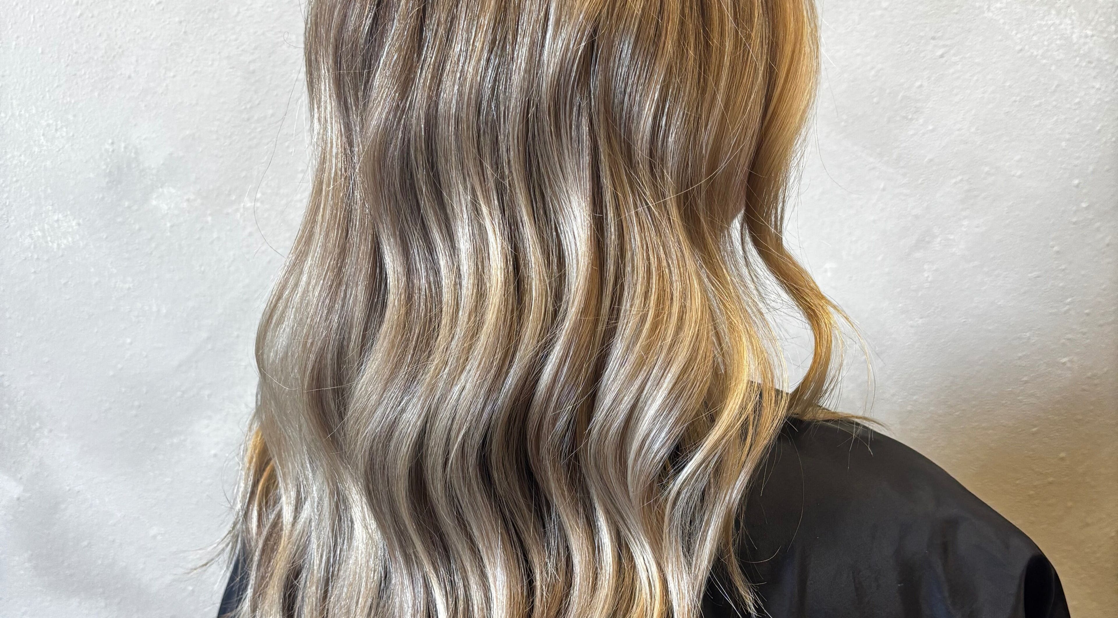 Elegant blonde waves styled at Bianna Stylez in Draper, Utah, US, showcasing luxurious hair texture.