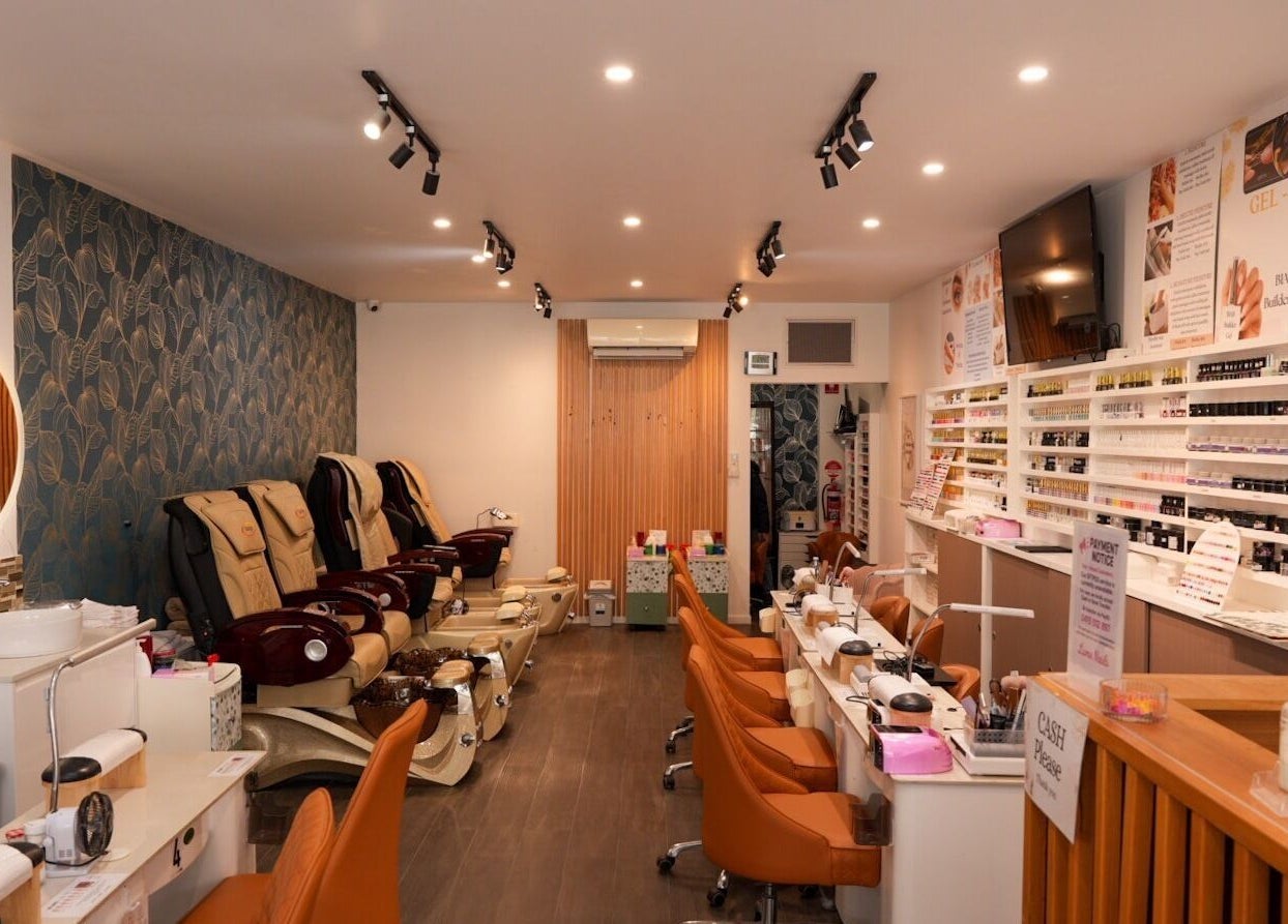 Interior of Lume Nails, Bell Park with nail stations and comfy chairs.