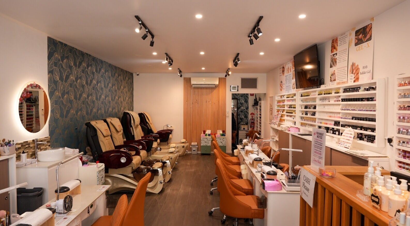 Interior of Lume Nails, Bell Park with nail stations and comfy chairs.