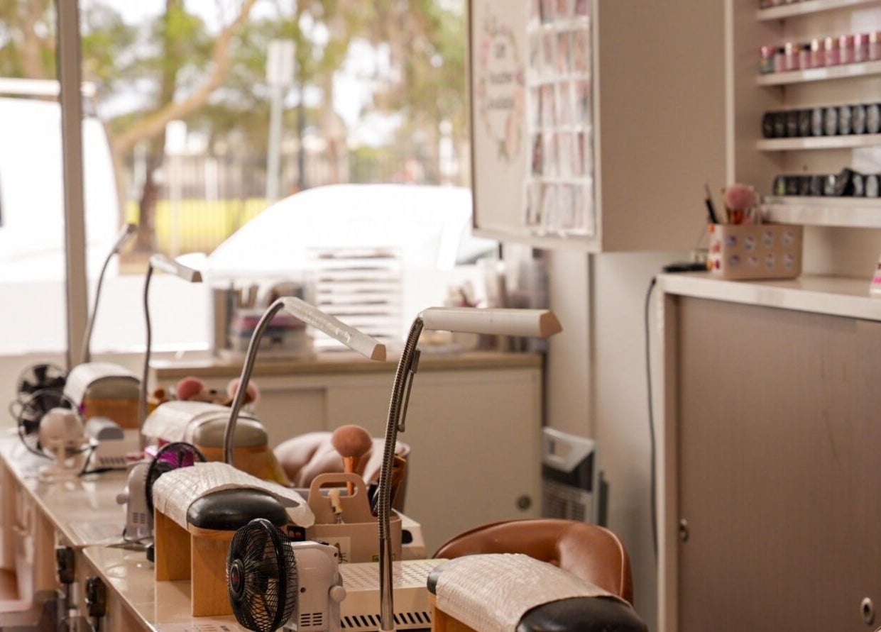 Elegant nail salon interior at Lume Nails, Bell Park, Victoria, AU, showcasing manicure stations.