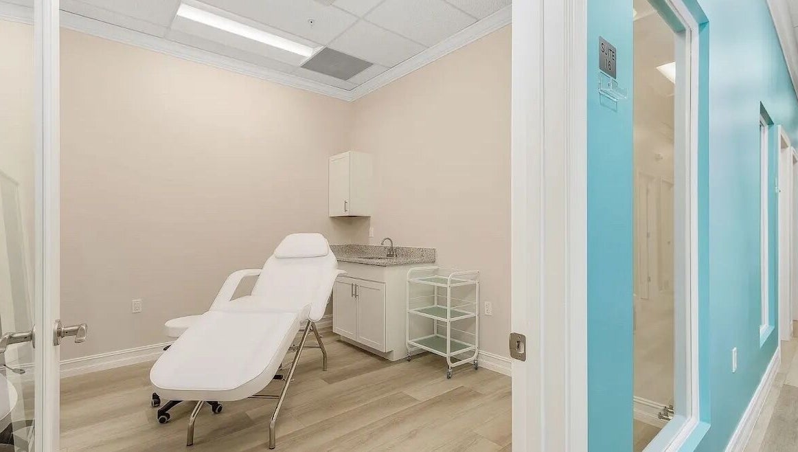 Relaxing treatment room at Glow Romantique, Palm Harbor, Florida, US, featuring a modern reclining chair.
