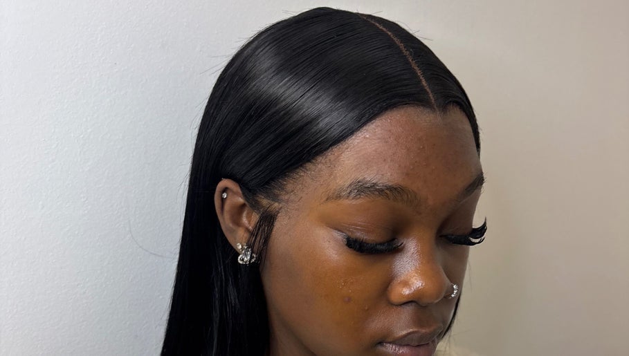 Woman with sleek hairstyle and lashes at kmstylesuk, Leicester, England, GB.