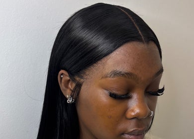 Woman with sleek hairstyle and lashes at kmstylesuk, Leicester, England, GB.