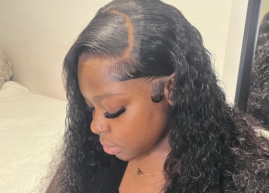 Woman with elegant wavy hairstyle at kmstylesuk, Leicester, England, GB showcasing stunning hair design.