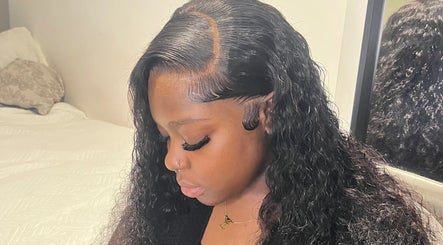 Woman with elegant wavy hairstyle at kmstylesuk, Leicester, England, GB showcasing stunning hair design.