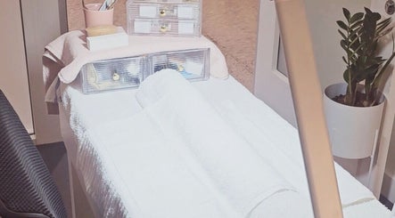 A serene spa room at Dazzlehood at Meta in Dublin, County Dublin, IE featuring a massage table and cozy ambiance.