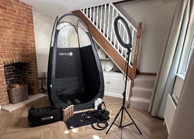 Glam + Tan's inviting tanning setup in Bishop's Stortford, England, GB with equipment and cozy ambiance.