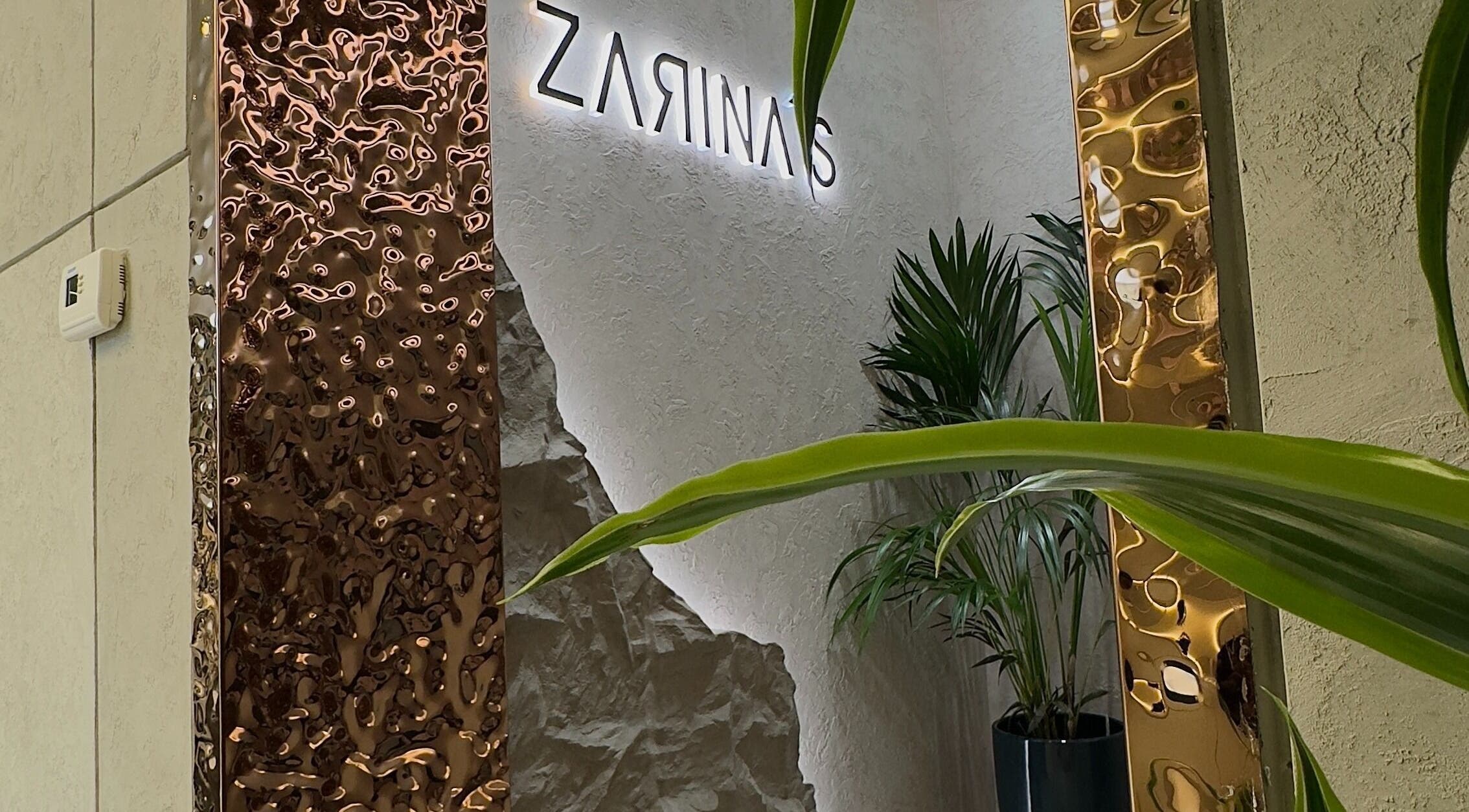 Sleek interior design at Zarina's Jabriya, Jabriya, Hawalli Governorate, KW. Featuring modern accents and lush plants.