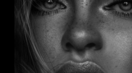 Close-up of a woman's face at 33 BEAUTY, Stratford-upon-Avon, England. Highlighting flawless skincare.