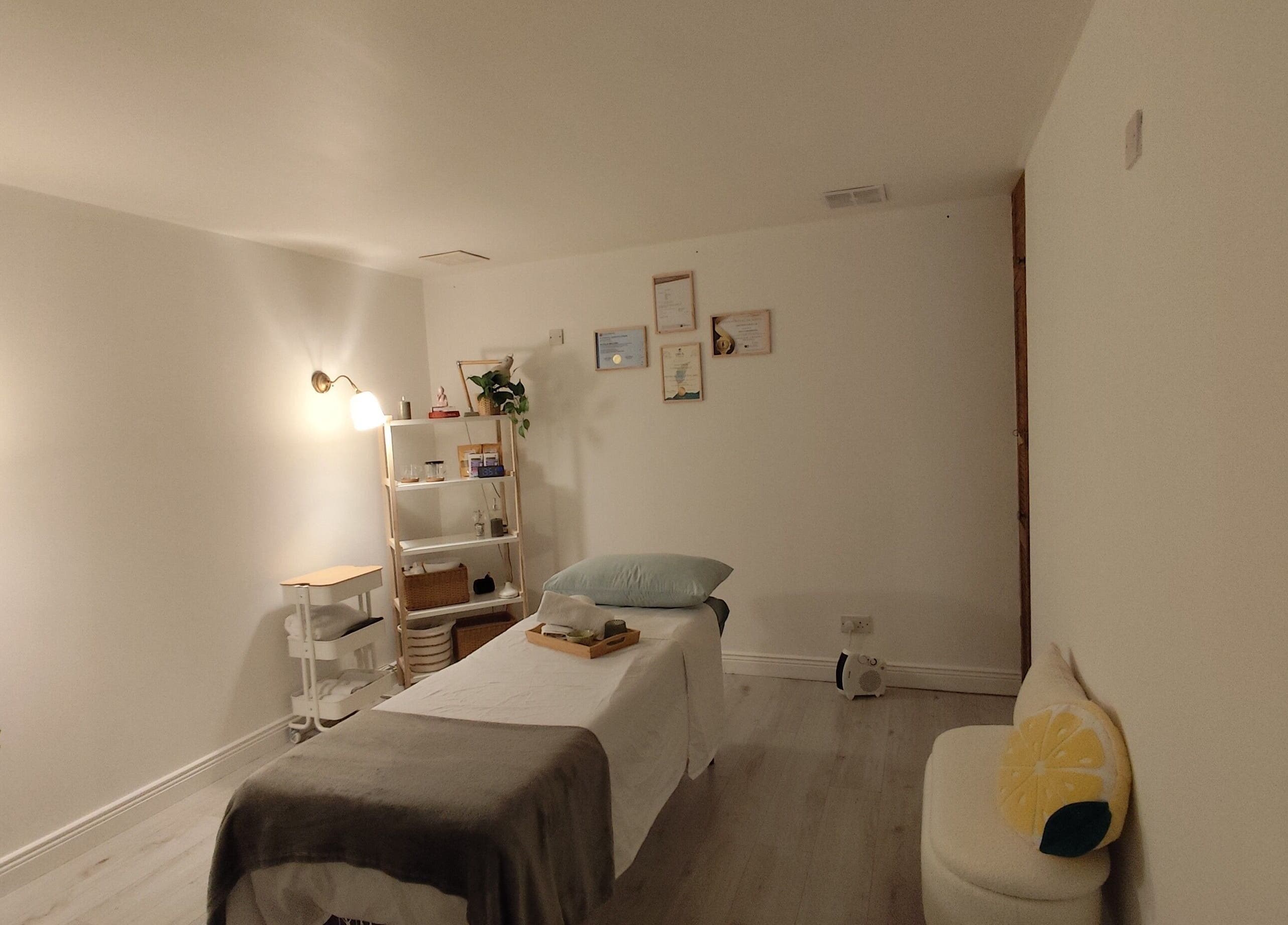 Peaceful therapy room at Sankalpa Therapies by Natalia Biscaro in Dublin, IE, featuring a treatment bed and soft lighting.