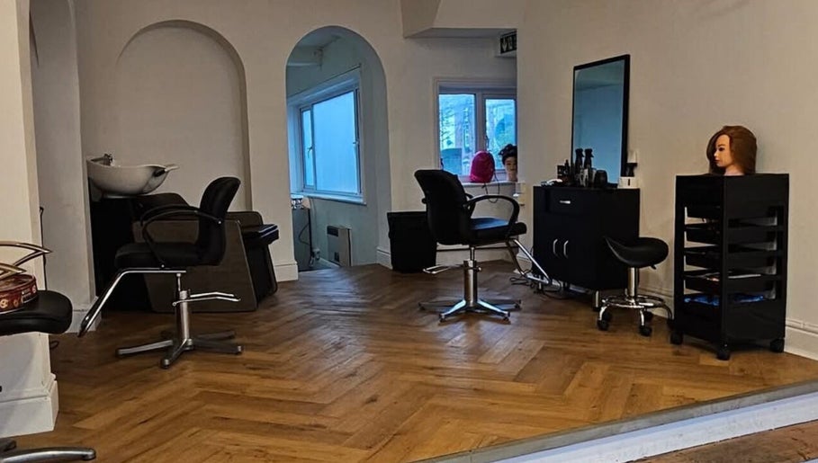 Modern salon interior at Hair by Kieren in Scarborough, England, GB featuring sleek styling chairs and decor.