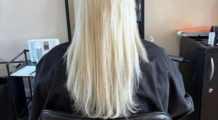 Long, sleek blonde hair styled at Hair by Kieren in Scarborough, England, GB.