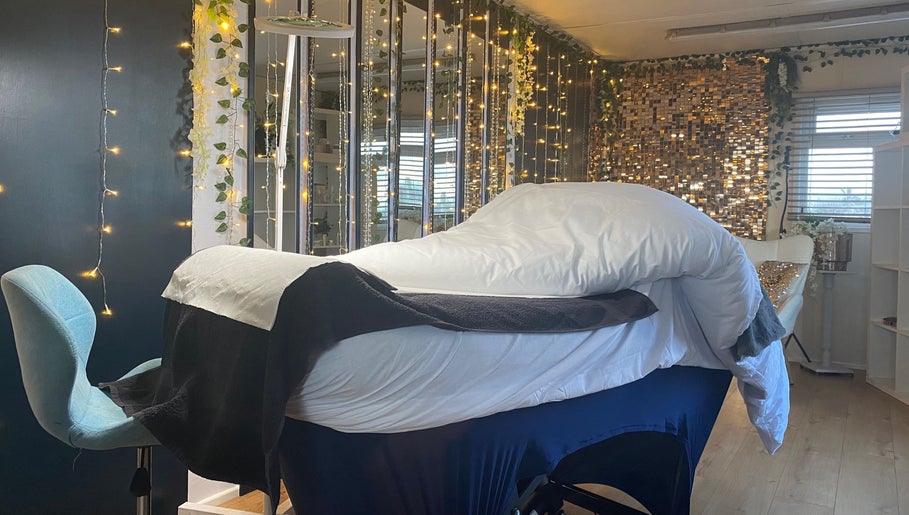 Tranquil massage room at Massage by Owen, Marden, England, GB, featuring soft lighting and cozy furnishings.