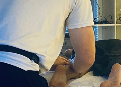 Massage therapy session at Massage by Owen, Marden, England, GB, focusing on foot relaxation.