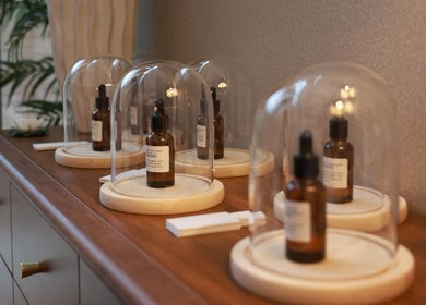 Glass-covered essential oils at Chanle Wellness Service, London, England, GB enhance the spa's calming ambiance.