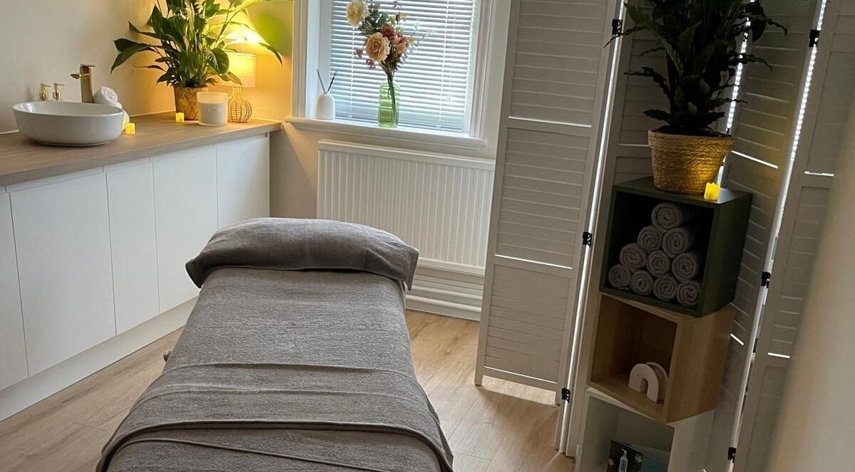 Serene treatment room at Regents Retreat, Nantwich, England, GB, featuring a massage table and elegant decor.