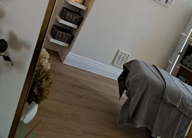 Cozy therapy room at Regents Retreat, Nantwich, England, GB, featuring a massage table and soothing decor.