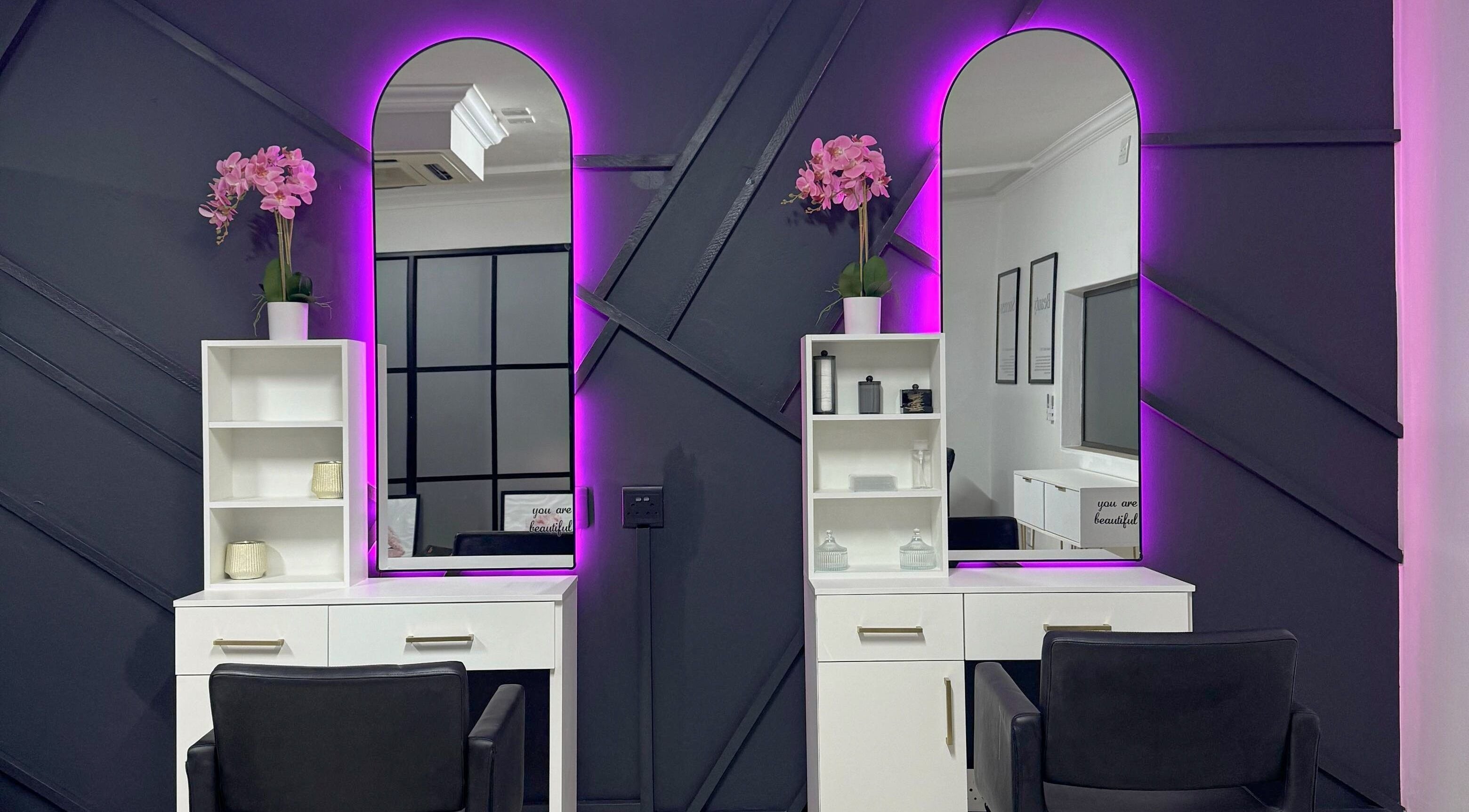 Chic salon setup with illuminated mirrors at Glow Up Beauty Salon, Pretoria, Gauteng, ZA.