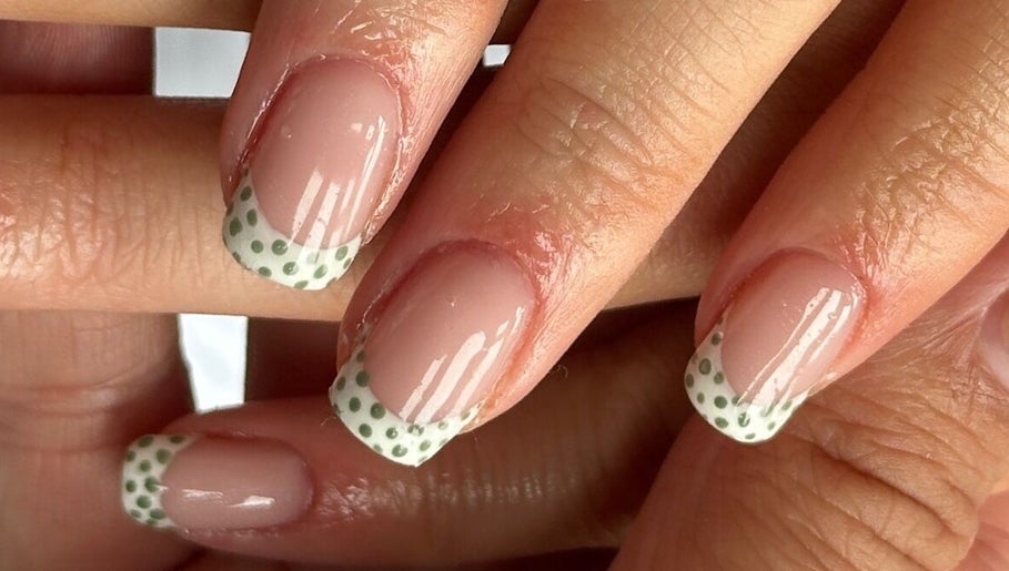 Polka dot nail art at Steel and Polish Nails in Sheffield, England, GB, showcasing chic manicure design.