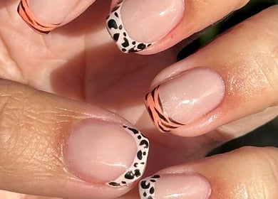 Stylish nail art at Steel and Polish Nails in Sheffield, England, GB with animal and stripe designs.