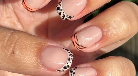 Stylish nail art at Steel and Polish Nails in Sheffield, England, GB with animal and stripe designs.