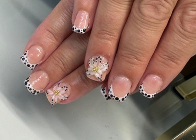 Elegant polka dot and floral nail art at Blushed Beauty by Amelia, Wormegay, England, GB.