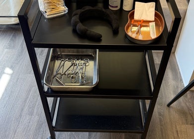 Medical tools on a cart at Obsession Medical Aesthetics, Bedale, England, GB, featuring syringes and scissors.