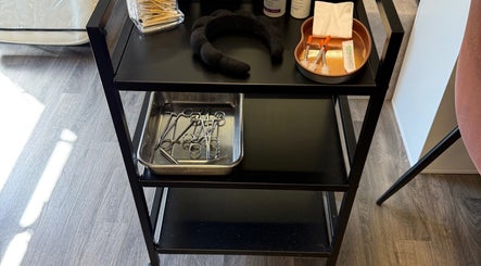 Medical tools on a cart at Obsession Medical Aesthetics, Bedale, England, GB, featuring syringes and scissors.