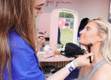 Makeup artist at Boots @ Main Arena in Portlaoise, County Laois, IE applying makeup outdoors.