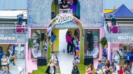 Entrance of Boots at Moonlight Meadows venue in Stradbally, County Laois, IE, showcasing vibrant event atmosphere.